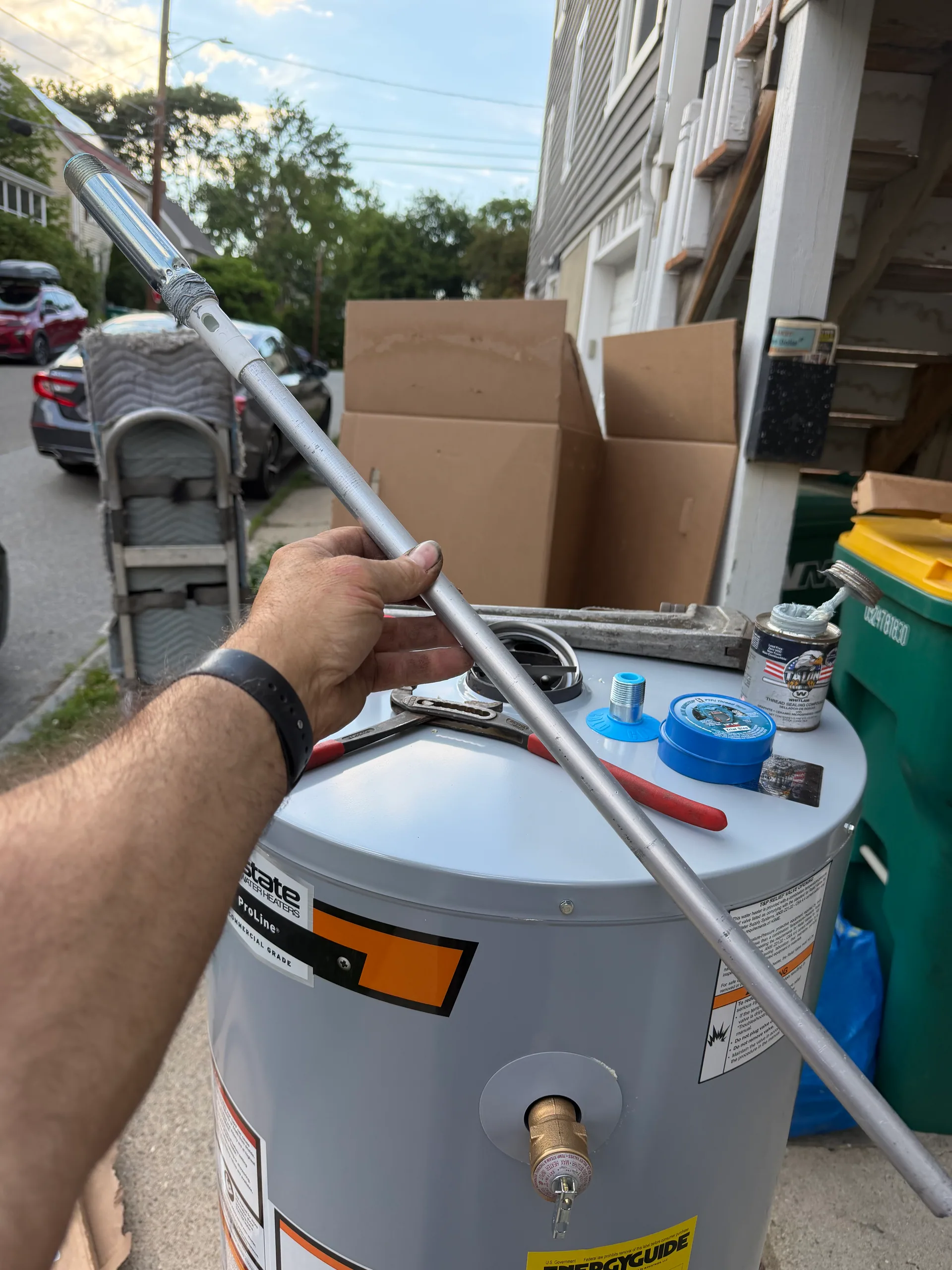 Corroded anode rod removed water heater melrose